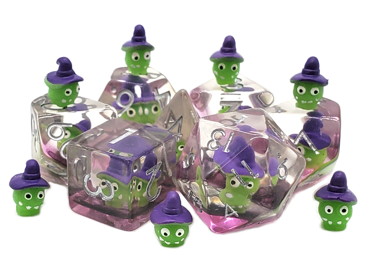 Set of small green characters with purple hats in clear cube containers on a white background