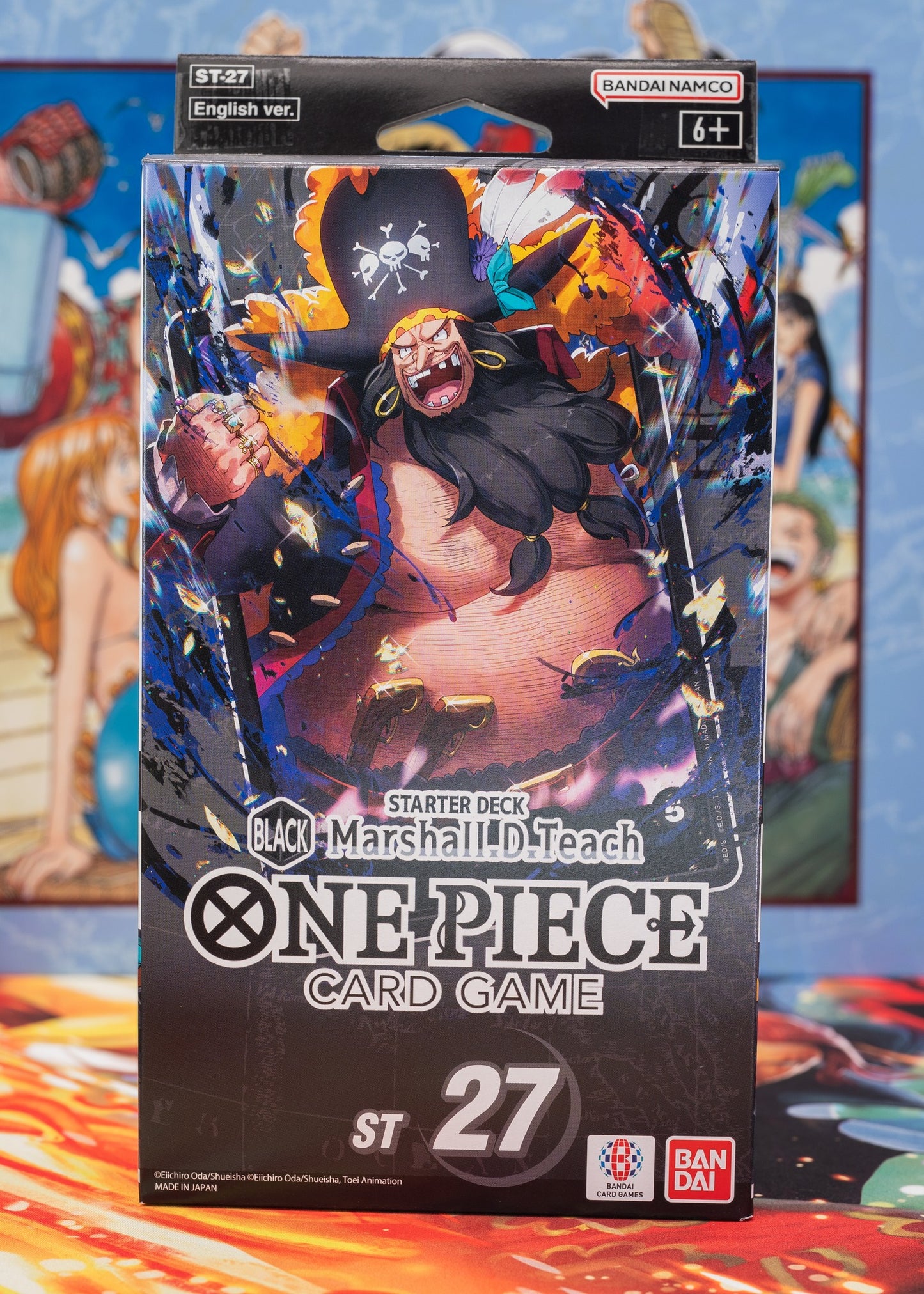 One Piece Card Game Starter Deck ST-27 featuring Blackbeard (Marshall D. Teach) – dynamic anime artwork with pirate hat, coat, and fiery background; Bandai Namco branding; suitable for ages 6+