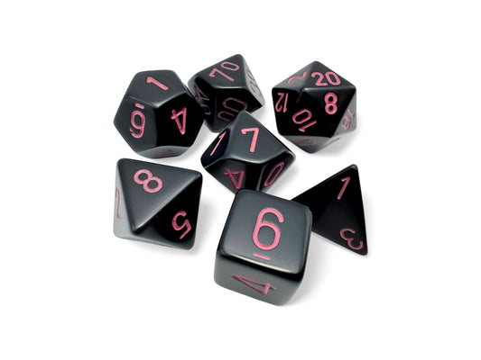 Chessex: 7 Piece Dice Set Opaque Black with Pink