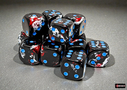 Black dice with blue and red brushed markings and blue pips on a gray surface, featuring the Chessex brand.