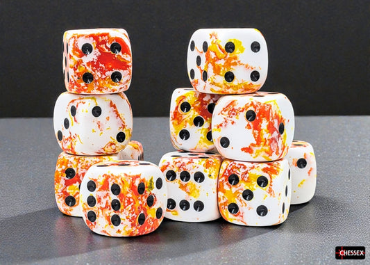 Stack of white dice with orange and yellow brush pattern on a gray surface