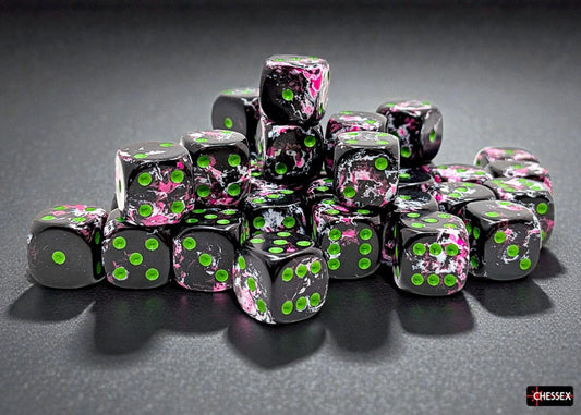 Set of dice with black, pink, and green design on a dark surface