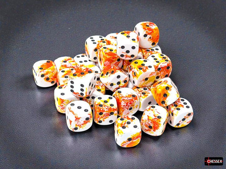 Set of white dice with orange and yellow brushed design with black pips on a dark surface, featuring the Chessex brand.