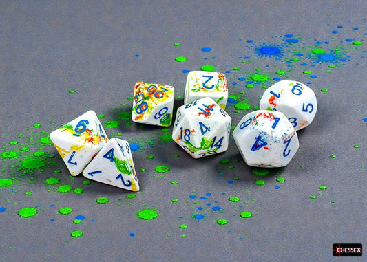 Set of white dice with yellow and green brush effect and blue numbers on a gray background
