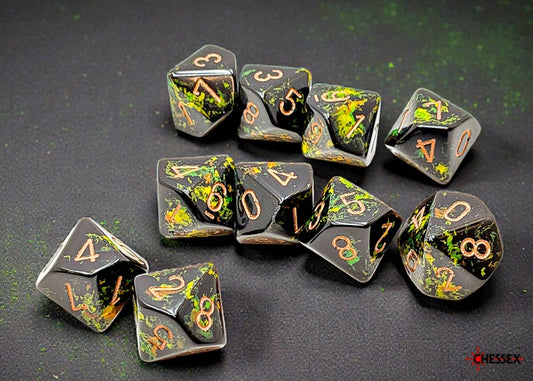 Set of polyhedral dice with a brush effect simulating foliage with gold numbers on a dark background