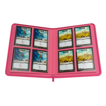 Pink Gamegenic Binder opened with trading cards on a white background