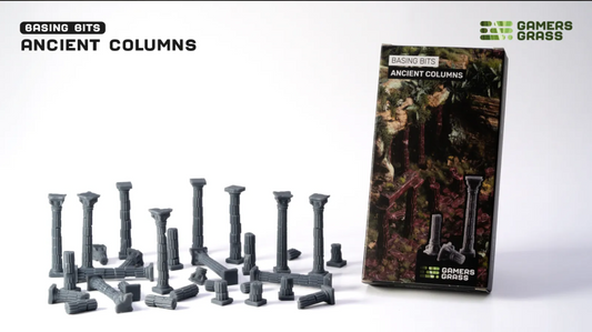 Model basing bits shaped like Greek columns on a white background with packaging