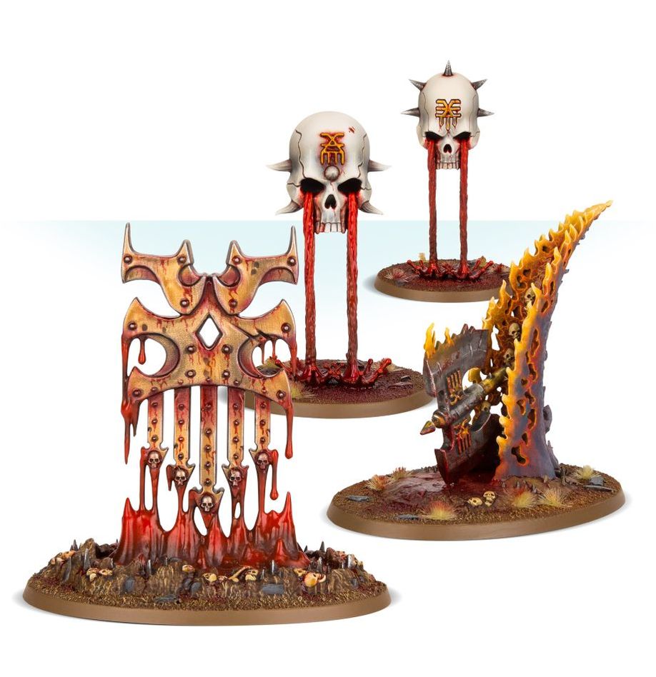 Gaming miniatures with skulls and fiery designs on a white background