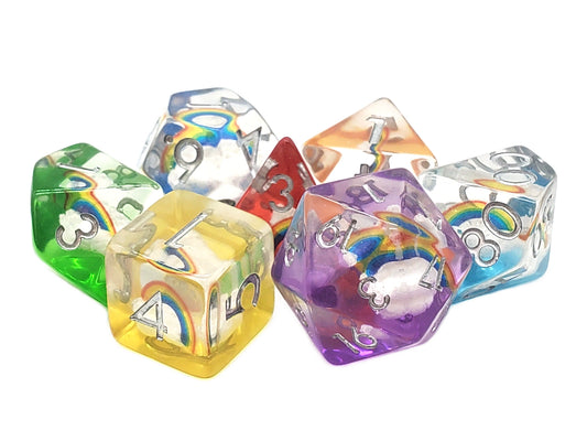 Set of colorful polyhedral dice with rainbow and cloud designs on a white background