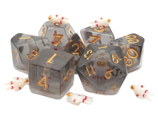 Set of clear dice with gold numbers on a white background