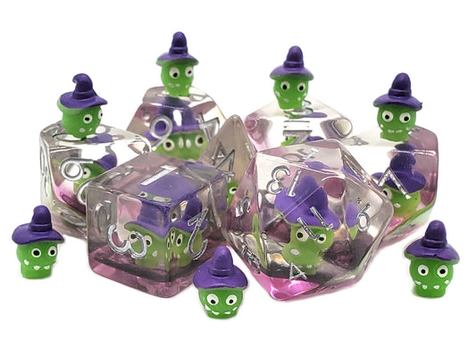 Set of small green characters with purple hats in clear cube containers on a white background