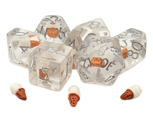 Set of clear dice with brown and white ice cream cone accents on a white background