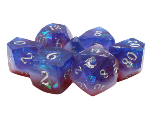 Set of blue and purple polyhedral dice with white numbers on a white background