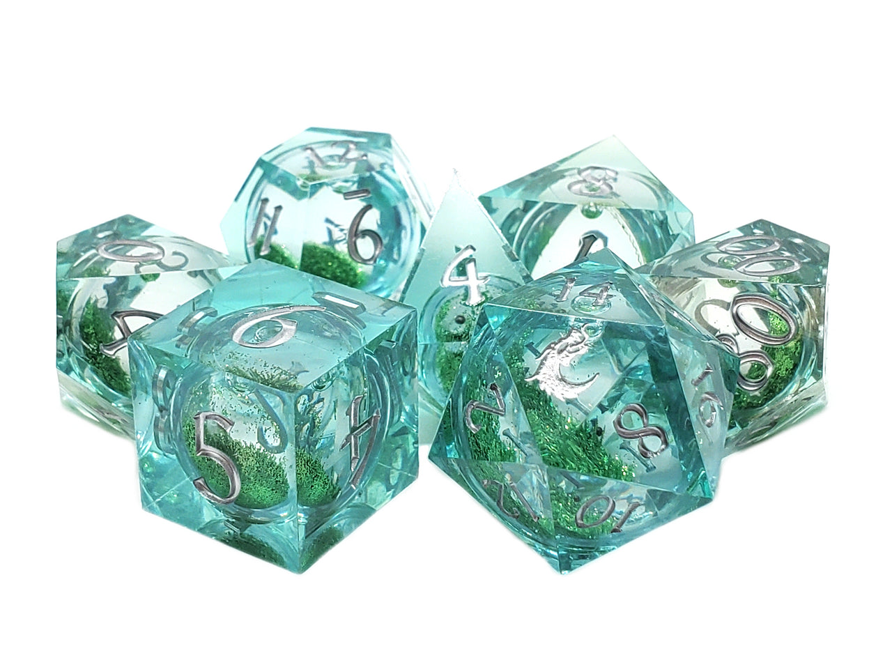 Set of teal polyhedral dice with green interior on a white background