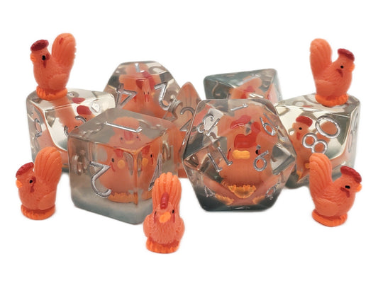 Clear dice with orange rooster figures on a white background