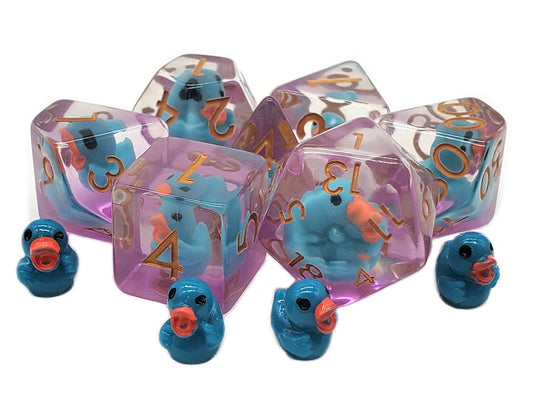 Set of blue dice with duck designs on a white background