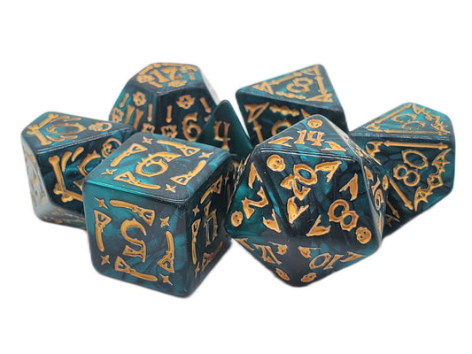 Set of teal dice with gold numbering on a white background