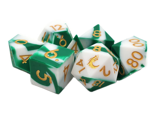 Set of green and white dice with gold numbers on a white background
