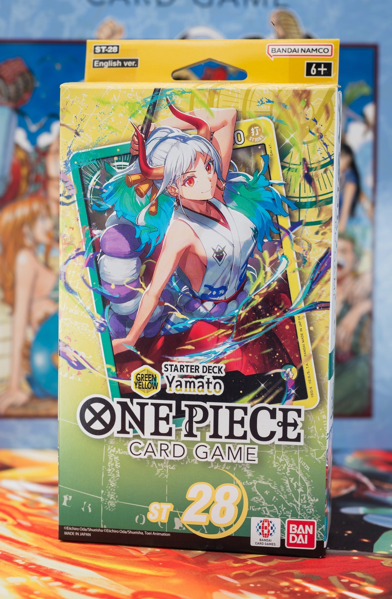 One Piece Card Game Starter Deck ST-28 featuring Yamato – English version with green packaging, vibrant anime artwork, Bandai Namco branding, suitable for ages 6+