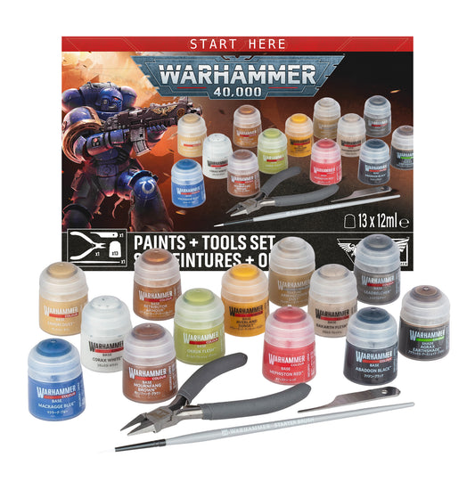 Warhammer 40,000 paints + tools set featuring a collection of 13 miniature paint bottles, pliers, a fine-tip brush, and a metal ruler, arranged in front of their retail box on a white background.