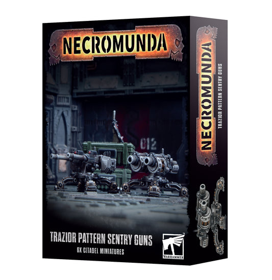 Boxed set of Necromunda: Trazior Pattern Sentry Guns, featuring four sentry gun models and two ammo crates, all in black with detailed metal and plastic components.