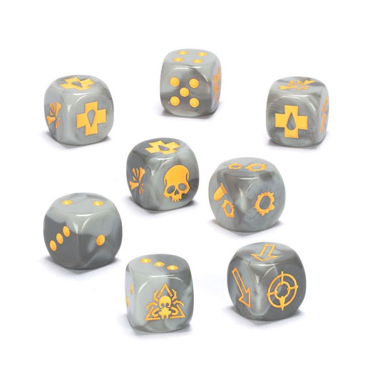 A set of eight grey dice with yellow markings, including symbols related to the Necromunda game, such as the Ash Waste Nomads icon.